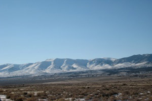 LEMAY ISLAND at Western Box Elder County, in Northwest Utah, approximately 35 miles north of I-80 at Wendover, Utah; about 2 miles east of Pilot Mountain Road, and 5 miles east of the Pilot Mountain Range. for From Interstate 80 near the Utah/Nevada state line, take exit 4 and go north. The road is paved for the first several miles, then becomes gravel. At approximately 35 miles from I-80, the road rises up a hill and proceeds north from the salt flats. About ½ mile north of the summit of this hill, and across from a sign that reads “Patterson Pass,” take a two-track road to the right (east). Lemay Island Mountain will be in front of you. Proceed two plus miles to the summit of the mountain. This is approximately the center of the property.